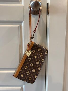 Dooney & Bourke Brown Logo Wristlet with Tan Trim and Red Strap